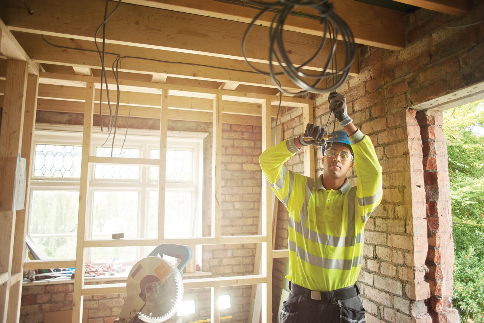 Young electrician on site