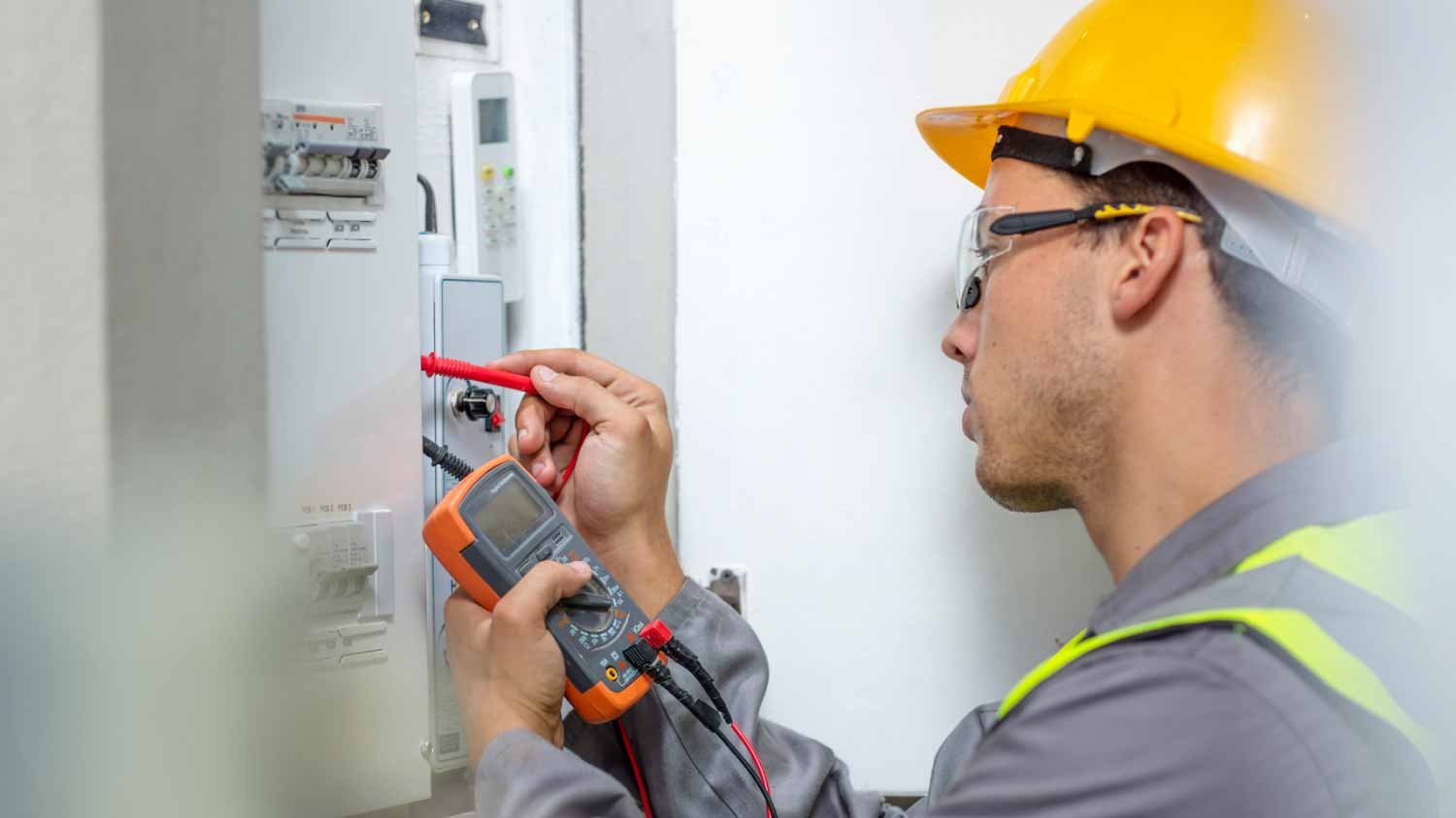 Electrician working–fuse box